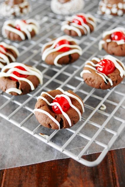 Cherry Chocolate Thumbprint Cookies ~ cute little cookies inspired by the flavors of classic chocolate covered cherries. Perfect for Christmas, Valentine's Day, or ANY day!  www.thekitchenismyplayground.com