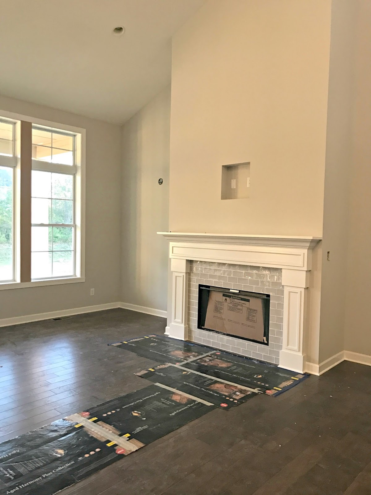 White fireplace with gray tile surround