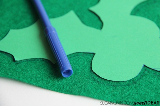 Make this bottle caps holly craft using recycled bottle caps for a fun Christmas tree holly ornament, a gift topper, or a holiday wreath.