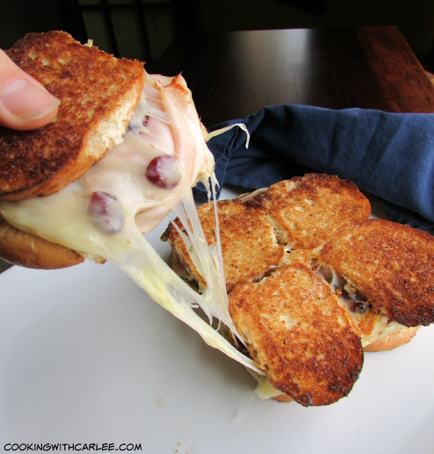 What is better than a grilled cheese? Not much! These sliders are snack size, butter, golden, cheesy and have pesto, dried cranberries, turkey and plenty of gooey cheese!