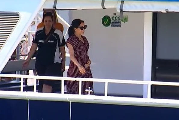 Meghan Markle wore &Other Stories Waist Knot Midi Dress and Sarah Flint Grear Lace Up Sandals. Prince Harry' Australia tour
