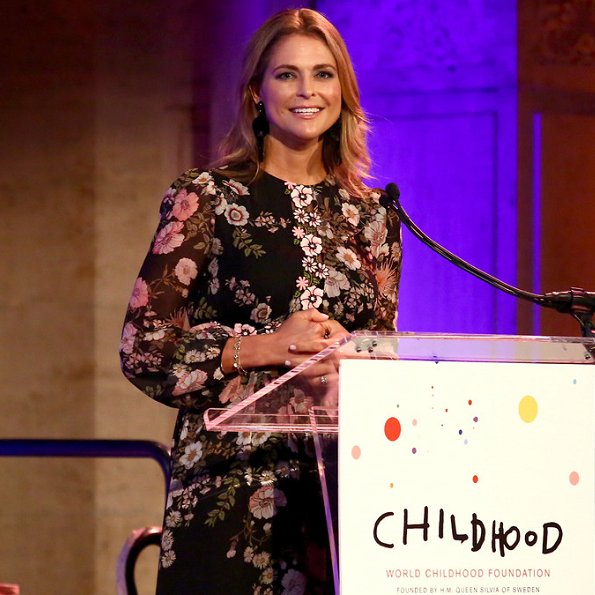 Princess Madeleine wore Giambatista ValliI floral print gown, and she carried Valentino Pink Rockstud clutch bag, Silvia wore a floral dress