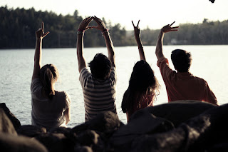 group of people spelling out LOVE