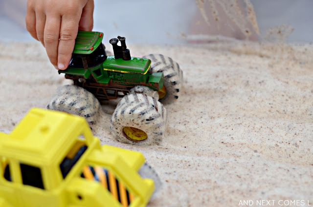 Messy sensory play idea for kids using cinnamon soap foam and tractors from And Next Comes L