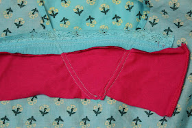 excess fabric at the neckline of tunic