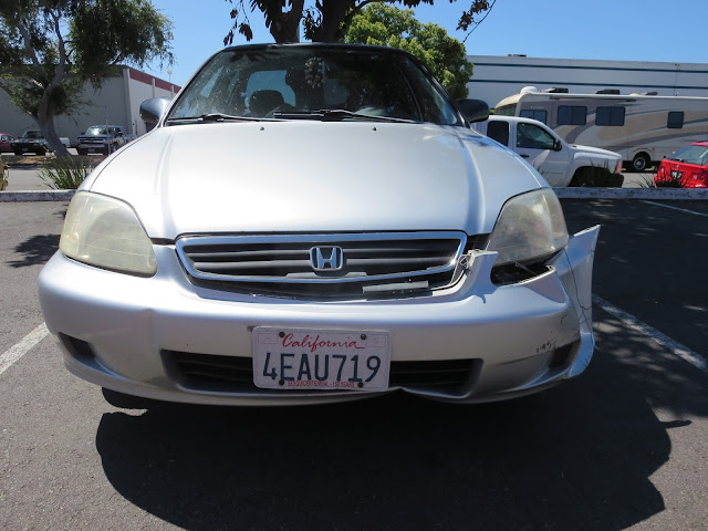 Civic with damaged bumper, grill and fender