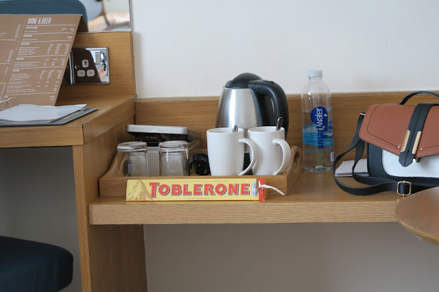 Settling in at the hotel with a Toblerone
