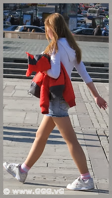 Girl in denim mini-skirt on the street  