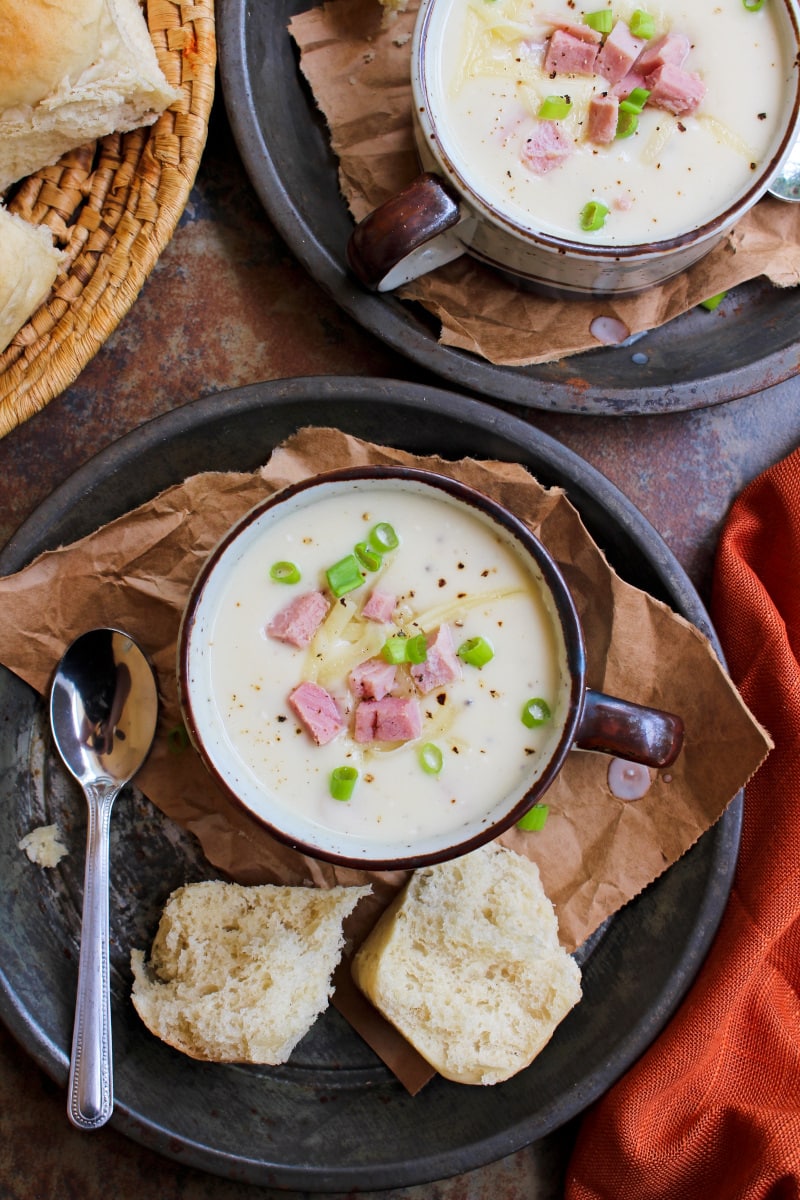 Instant Pot Cheesy Cauliflower & Ham Soup is creamy and delicious made with a head of cauliflower, ham, and white cheddar cheese.  It comes together in under a half an hour and is a great way to use up leftover ham! #soup #leftoverham #cauliflower