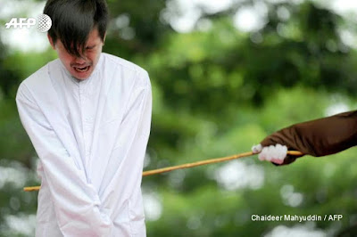 Photos/video: Two men publicly given 85 strokes of cane in Indonesia for having gay sex Photos/video: Two men publicly given 85 strokes of cane in Indonesia for having gay sex
