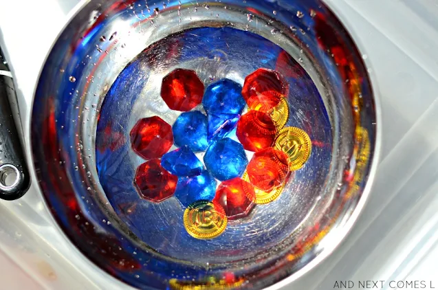 Gems and gold coins in a pirate sensory activity with water