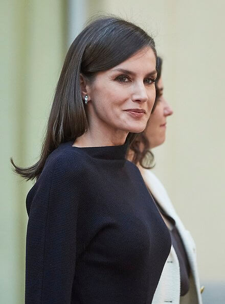 Queen Letizia wore Cos draped-neck ribbed wool dress. The Queen handed out the awards to the awardees of National Research Awards