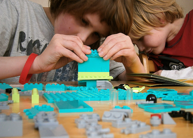 children building bricks like lego