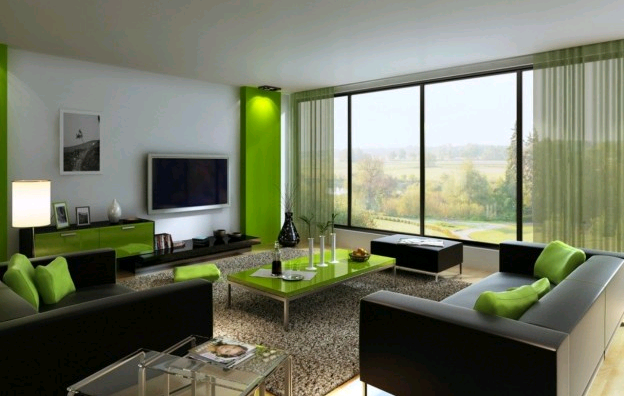 Arredi e complementi verdi nella zona giorno abbinati al grigio dei divani creano un ambiente elegante e soft