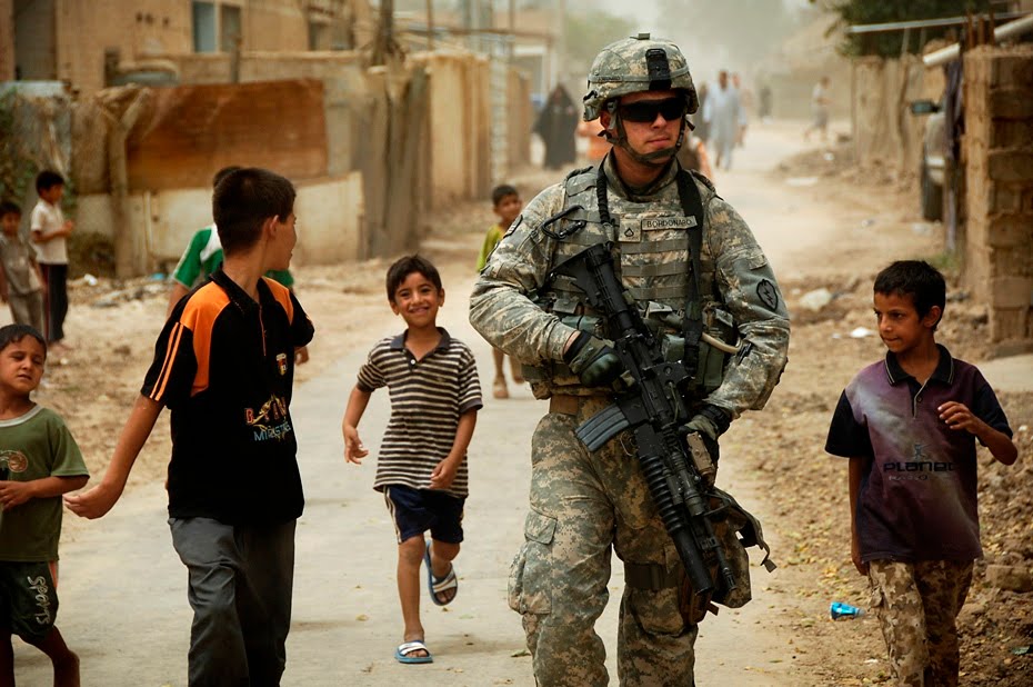 Spc.Daniel Herrera, "US Army Pfc.Shane Bordonado & Children of Al Asiriyah, Iraq" (August 4, 2008)