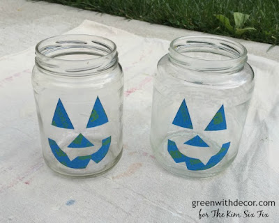 Make these cute jack-o-lanterns from old pickle jars with some orange spray paint. What a fun Halloween craft! 