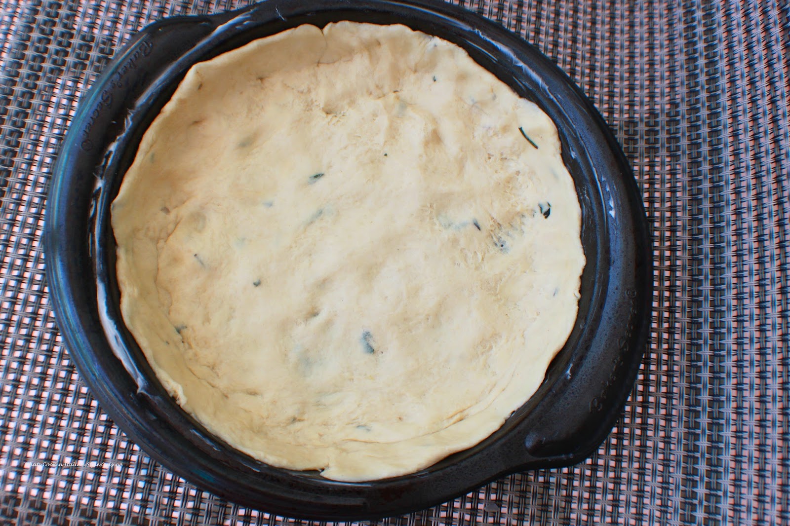 This is delicious pizza dough stuffed with cheese and fresh herbs. A  homemade bread dough that was mom's recipe. This is called a focaccia and italian herb bread that is stuffed with cheese. Rosemary is a main herb flavored in this bread along with black pepper and fresh basil