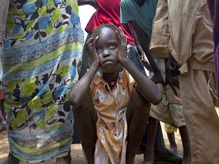 A young Sudanese refugee girl in distress.