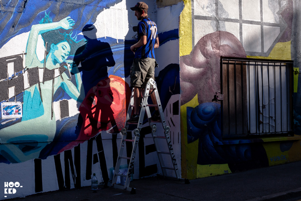 Dublin based artist Garreth Joyce at work on a mural for Waterford Walls Dublin based artist Garreth Joyce at work on a mural for Waterford Walls