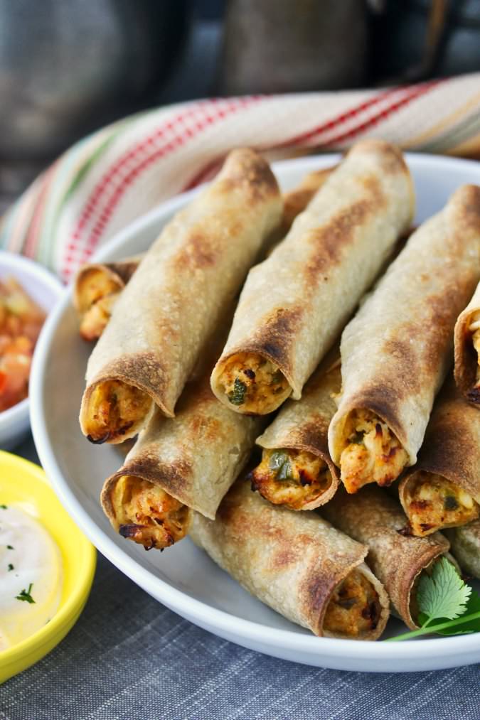 Crispy Baked Chicken Taquitos with dipping sauces Crispy Baked Chicken Taquitos with dipping sauces
