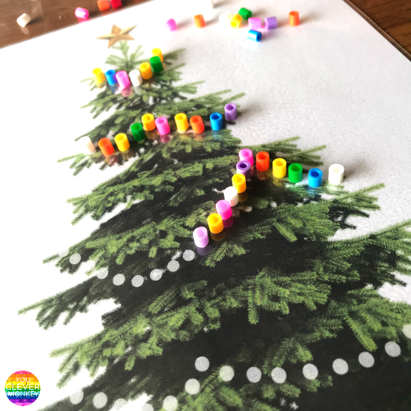 How to Use Christmas to Encourage Writing - why mark making is important to writing development along with 20 different ideas to encourage mark making at Christmas time to help young children develop their writing skills | you clever monkey