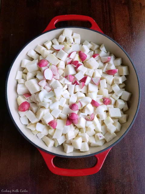 cubes of veggies in cast iron pan ready to be cooked