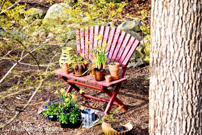 Spring Garden Nook: A colorful bench, clay pots, a few decorative items, and spring flowers create a pretty nook in the backyard | Ms Toody Goo Shoes