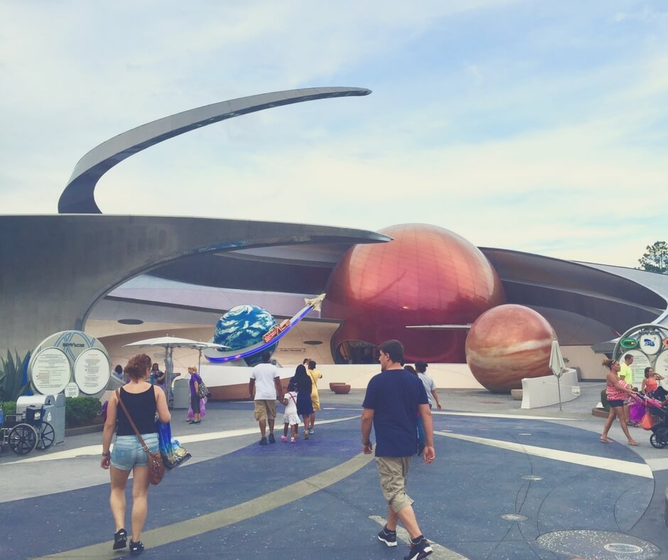 The entrance at Mission: SPACE, showing a red planet with swirls around it.