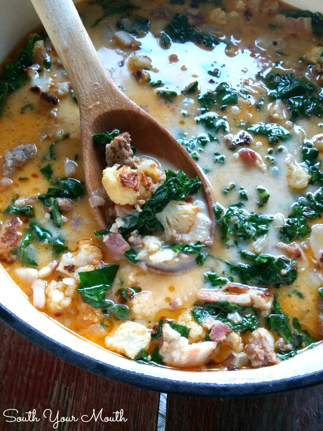 Low Carb Zuppa Toscana! Made with roasted cauliflower instead of potatoes. This soup has ALL the flavor of the Olive Garden hit recipe! Post also includes the traditional recipe with potatoes. 