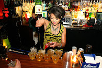 Bartender pouring a drink in a nightclub