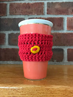 red cup cozy with yellow bead 