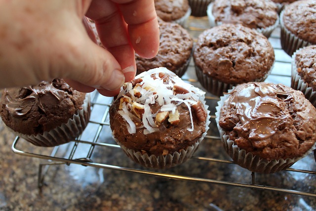 Food Lust People Love: Rich, chocolately muffins with pecans, coconut, hazelnut spread and chocolate chips, these Coconut Pecan Brownie Muffins as gorgeous as they are delicious.