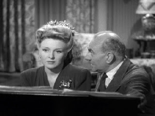 Prof. Morris (George Zucco) makes a play for Isabel (Evelyn Ankers)