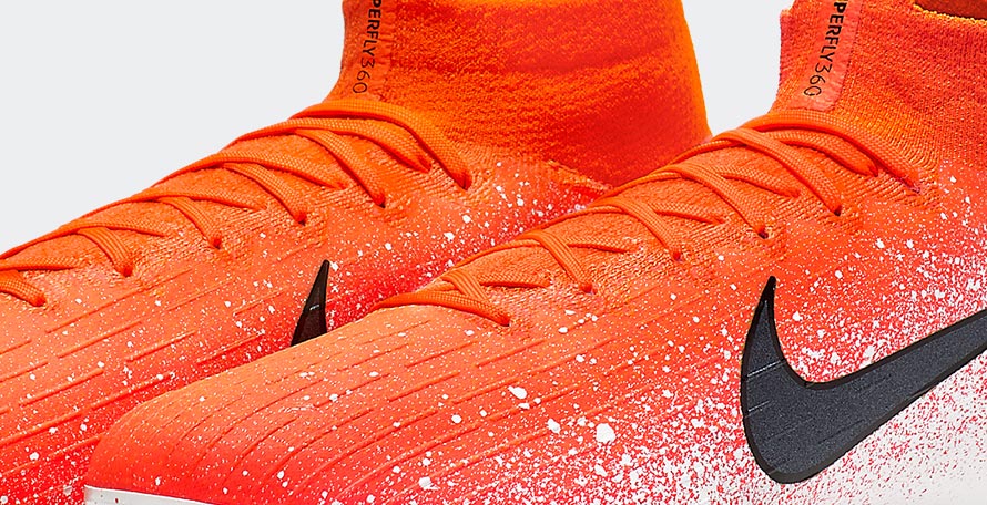 orange and white nike boots