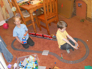 lego train track shaped like a willy with lego buildings