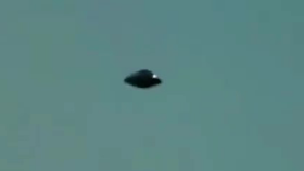 Two black UFOs over a city in urban places in the daytime as well is unusual indeed. Two-black-UFOs-over-a-city-in-urban-places-in-the-daytime-as-well-is-unusual-indeed.