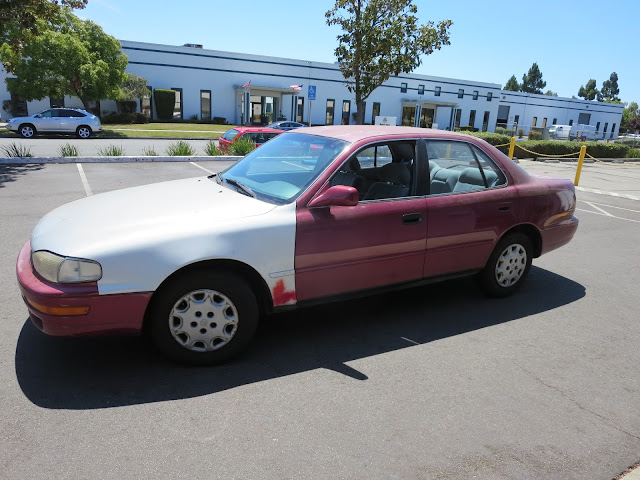 1995 Camry with bad paint and collision damage before repairs at Almost Everything Auto Body