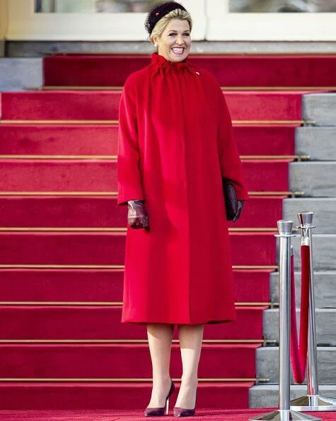 Queen Maxima and First Lady Agata Kornhauser-Duda attended the lunch at Royal Palace. She wore a red wool coat by Natan