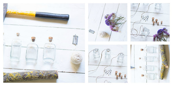 Rama con botellas de cristal y flores