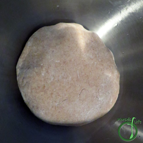Morsels of Life - Basic Pizza Crust Step 4 - Cover the dough, and let it sit in a warm spot until doubled in size. Freeze for later use or roll out and make a pizza! (Optional - I like to pre-bake my pizza crusts since it results in a more crisp crust.)