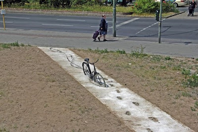 bicycle tracks and footprints in wet concrete fail funny