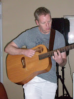 Greg playing guitar