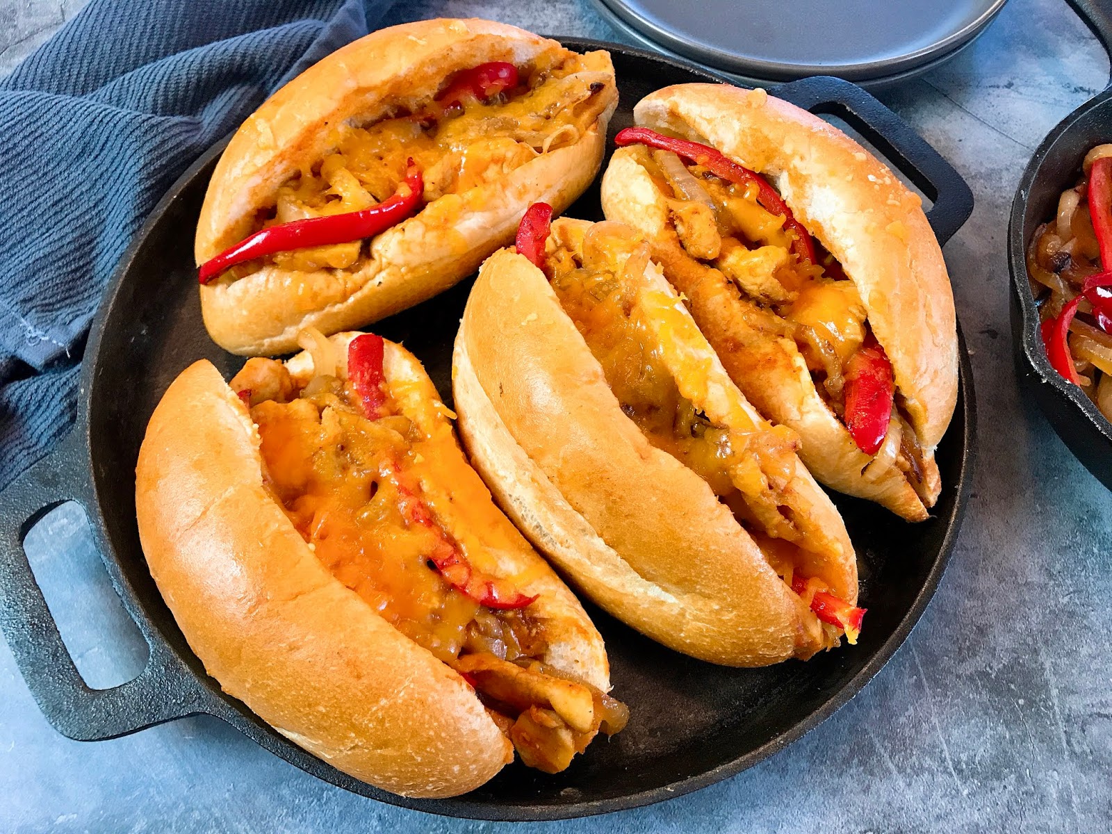Barbecued Chicken Cheese Steaks with Caramelized Onions and Peppers