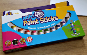 A set of coloured paint sticks in the box