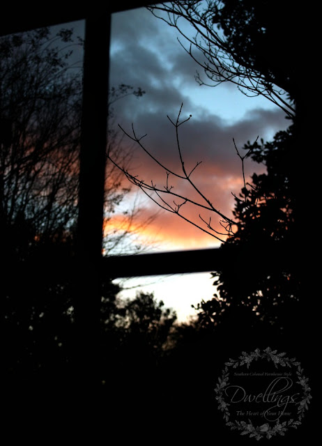 Through the kitchen window the sun is setting
