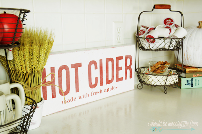 This DIY Hot Cider Sign was made from a thrift store canvas for inexpensive fall decor.
