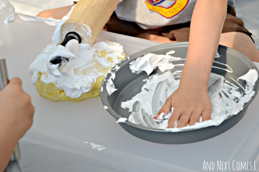 Messy sensory play for toddlers and preschoolers with lemon scented play dough and shaving cream from And Next Comes L