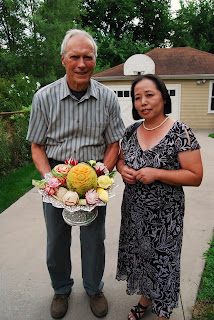 Clint Eastwood with Chef Genevieve Vang Clint Eastwood displays food that Chef Genevieve prepared during the filming of Gran Torino.