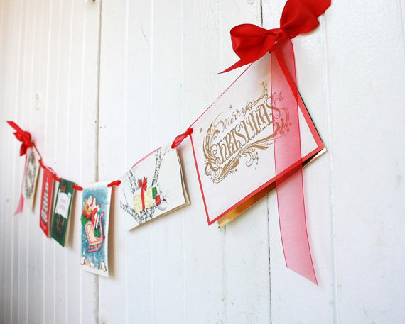 making a festive holiday garland out of old christmas cards is ...