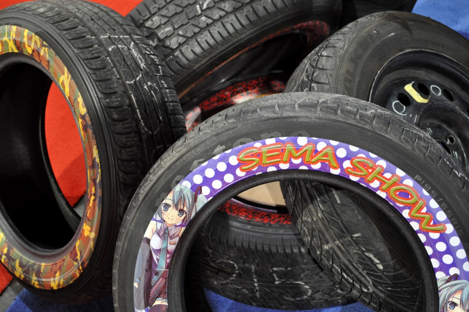 Just A Car Guy something new in tires, paintings on the sidewalls